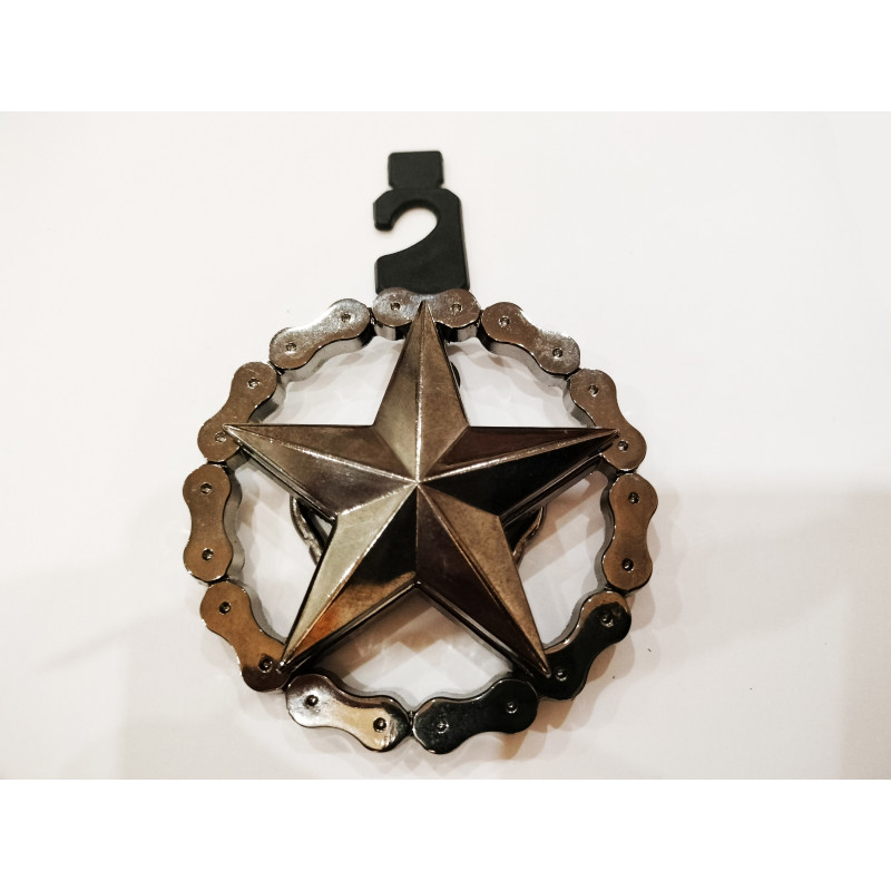 Belt buckle in the shape of a chain and stars, approximate size 9 cm x 7 cm. The outer star rotates